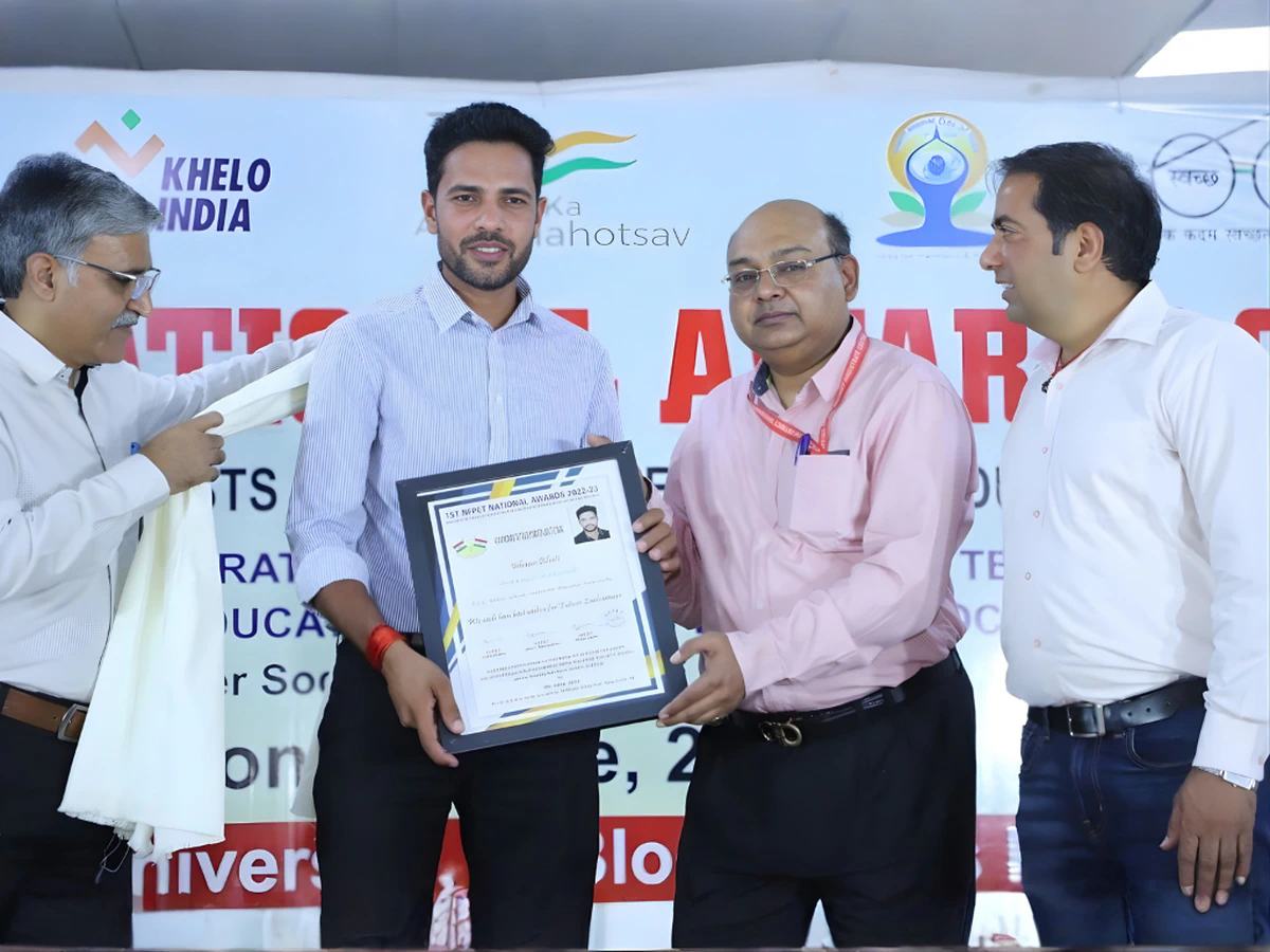 Coach Ishwar Bhati with the NFPET Best Coach (Basketball) Award