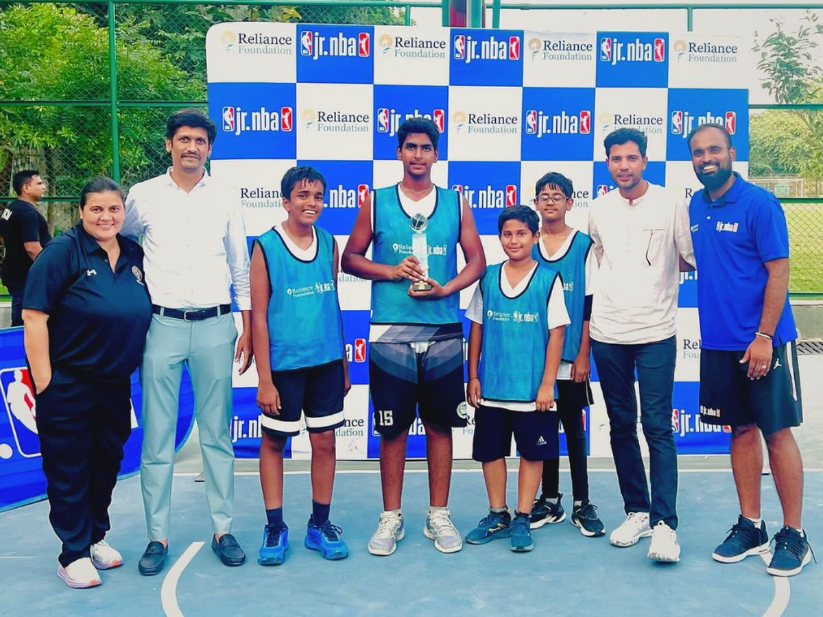 IB Sports Academy U-12 team celebrating their Jr. NBA 1st place win