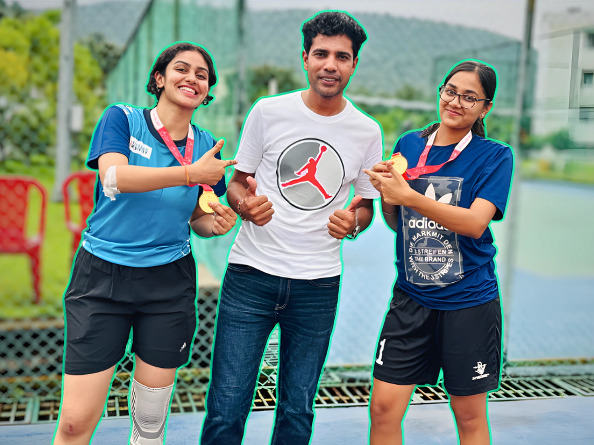 Coach Ishwar Bhati with G. Prerna and Veda holding their National Gold Medals
