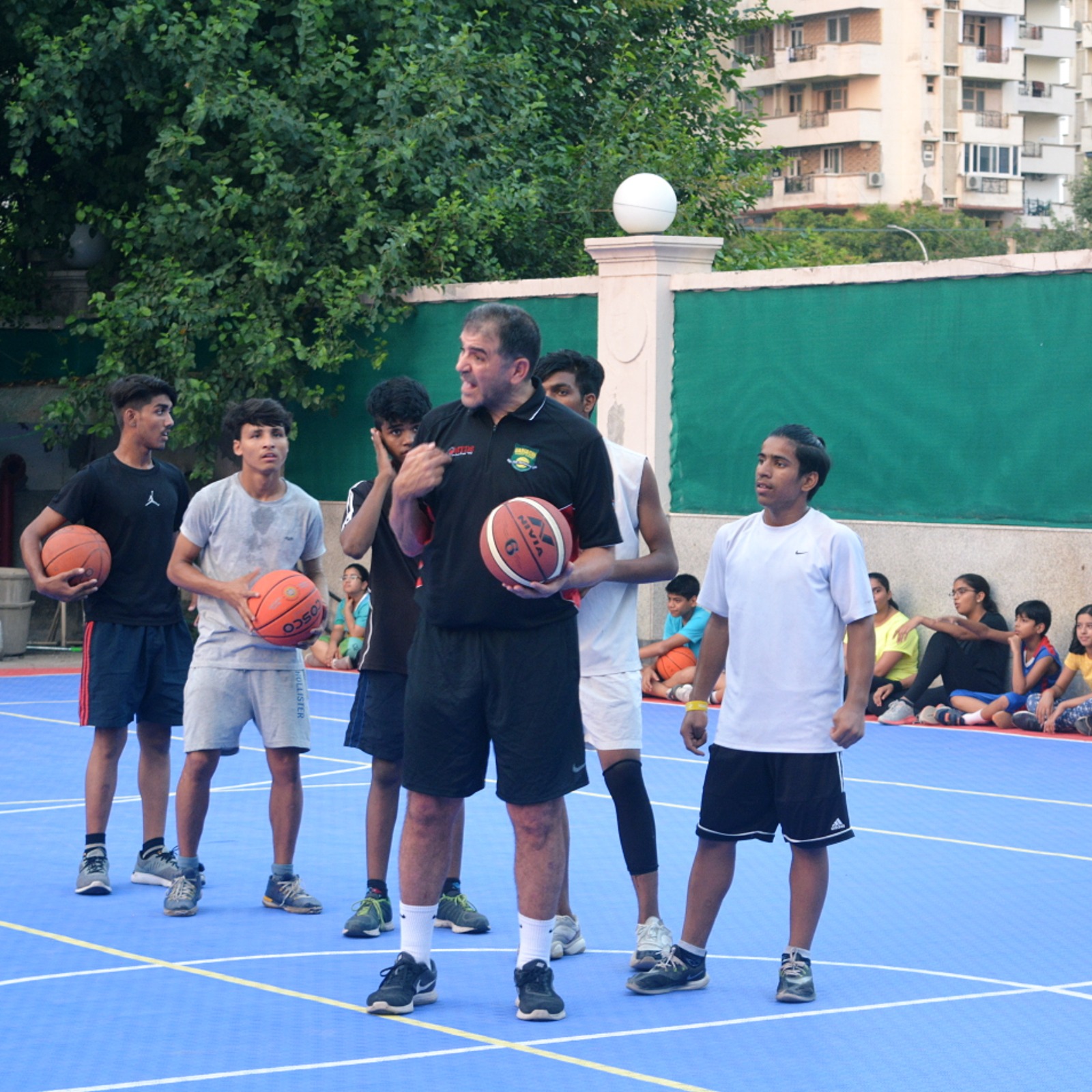 Coach Naoufal Uariachi Explaining Tactical Basketball Positioning to the 'Rise Through Hoops' Participants