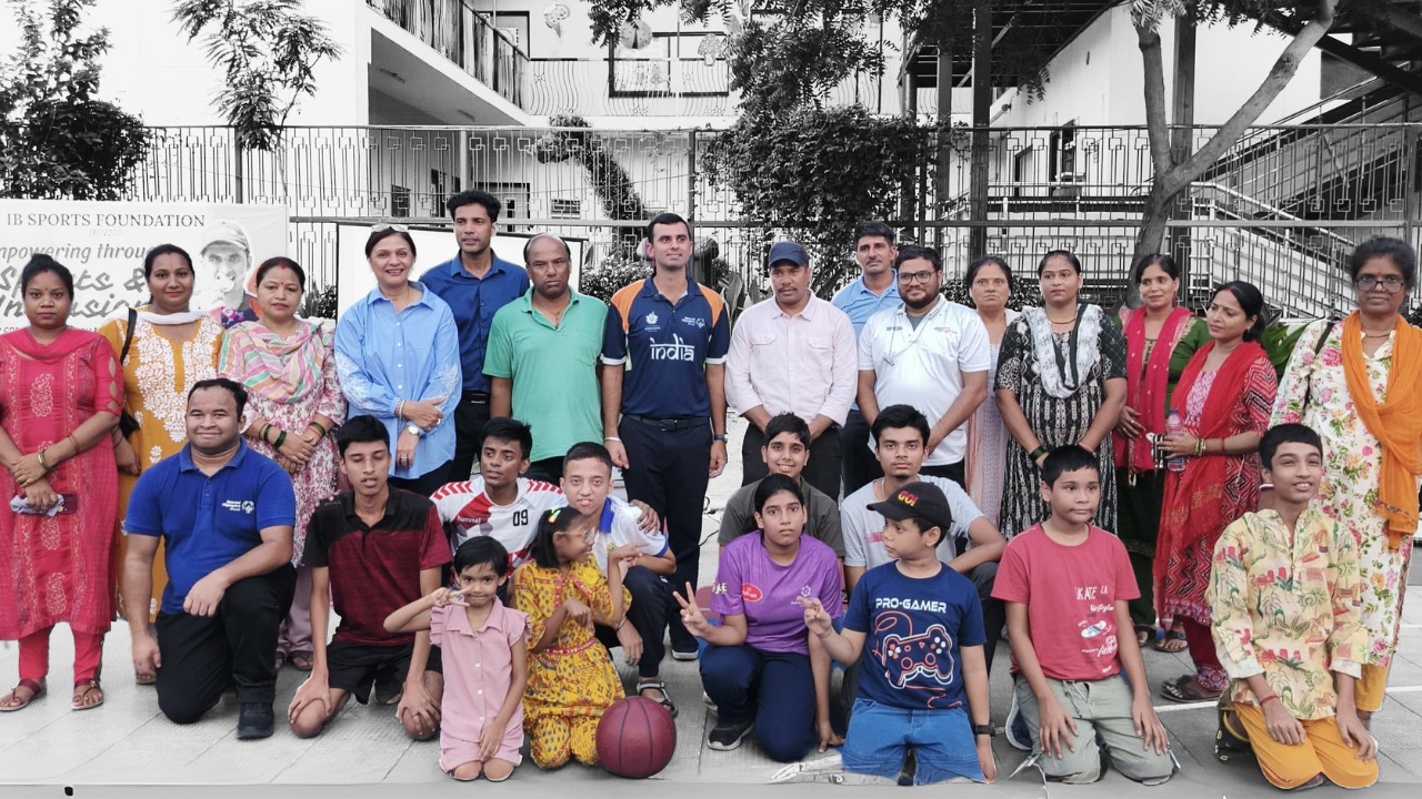 A Heartwarming Group Photo of Families and Special Needs Children at the IB Sports Foundation Event